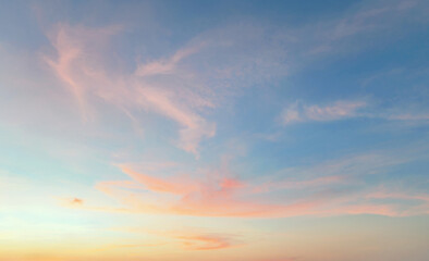 Fototapeta premium Soft clouds drift across a gentle blue sky