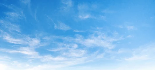 Clear blue sky with wispy white clouds © lovelyday12