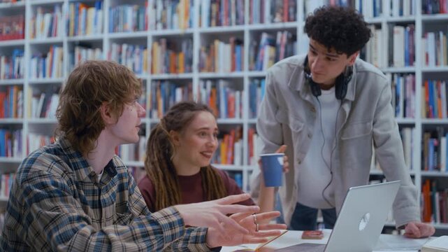 Collaborative learning comes to life as college students discuss their assignment with focused energy. One student explains a concept while others listen, take notes, and contribute fresh perspectives