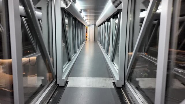 Aircraft Garbarata Bridge linking terminal to airplane entrance.
