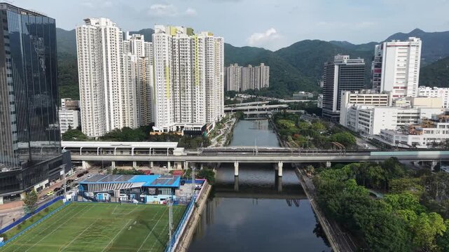 On Ming Street roadway beside residential towers and canal May 12 2026