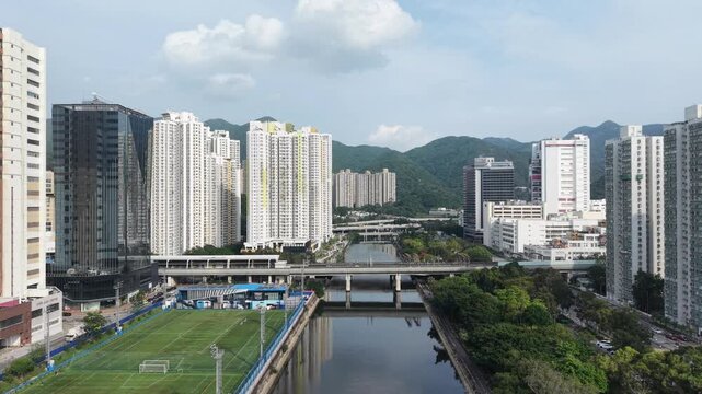On Ming Street roadway beside residential towers and canal May 12 2026