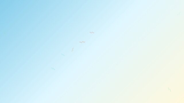 A serene blue sky with a flock of distant birds flying in the bright light