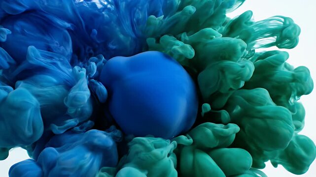 A vibrant, abstract image showcases a swirling cloud of blue and green ink suspended against a stark white background, creating a dynamic and visually captivating composition.