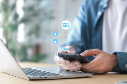 Cybersecurity protects Login , Businessman using mobile phone to log in securely with user interface screen data protection, privacy, authentication, and online security.