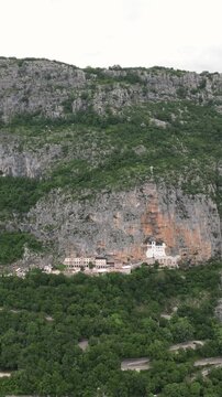 Aerial view of the historic Ostrog Monastery, a Serbian Orthodox church built on a sheer cliff in Montenegro, Balkans