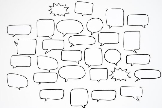 Pattern of black and white speech bubbles on a white background. Communication and social connections concept. Looped 4K stop motion animation