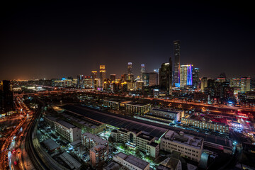 Fototapeta premium Winter snow scene and city night view of China Zun, Central Business District, Beijing, China