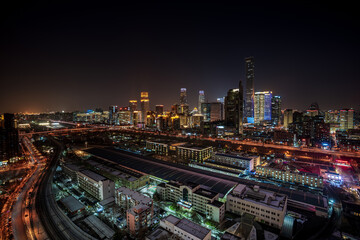 Obraz premium Winter snow scene and city night view of China Zun, Central Business District, Beijing, China