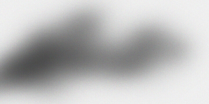 Abstract background with soft gray gradient and subtle grainy texture, creating smooth and ethereal visual effect.