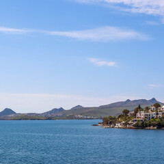 Fototapeta premium Bitez bay in Bodrum, Turkey with coastal homes on a green hillside overlooking the Aegean Sea