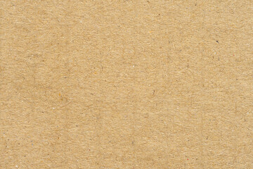 Fototapeta premium Top view of brown kraft paper texture background,Close-up texture of brown kraft paper sheet with fine fiber details, ideal for eco-friendly packaging design, organic branding, and rustic background.