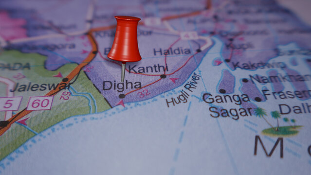 Red thumbtack on map highlighting Digha, West Bengal, India, near Hugli River. Concept for travel and tourism.