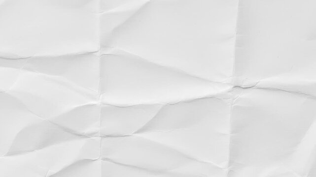 Abstract Crumpled Paper Transition,Animated stop motion of wrinkled white paper unfolding on a black background.Video 4k resolution.Video effect