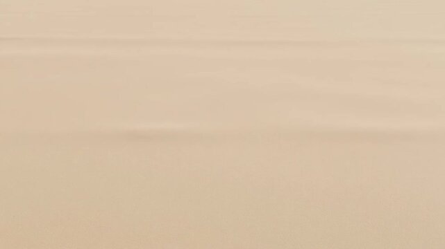 The series of frames depict a person engaging in a beach activity, possibly preparing to surf or paddleboard