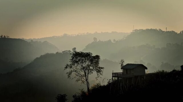 Foggy Mountain Valley Sunrise with Rural Hut and Misty Hills Landscape