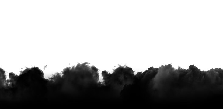 Dense dark smoke billows upwards in a dramatic formation across the bottom of this high quality photograph capturing the organic movement and chaotic textures of thick swirling clouds of soot