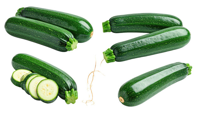 Assortment of fresh, green oblong vegetables, some whole, others sliced, showcasing vibrant color on a black background