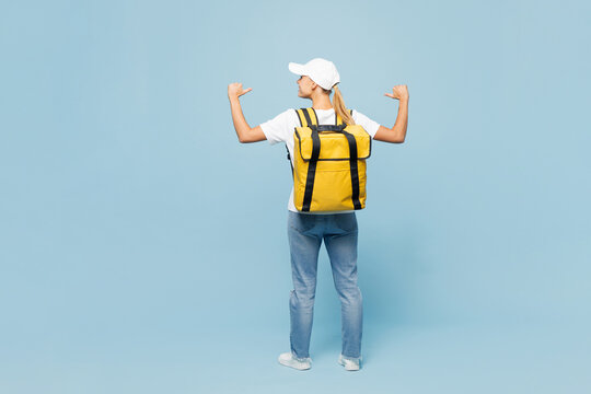 Full body delivery employee woman wear white cap T-shirt uniform yellow thermal food bag backpack workwear work as dealer courier isolated on plain pastel light blue background studio Service concept