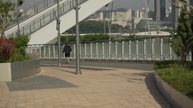 Man Jogging on Geumgang Pedestrian Bridge in Sejong City, South Korea