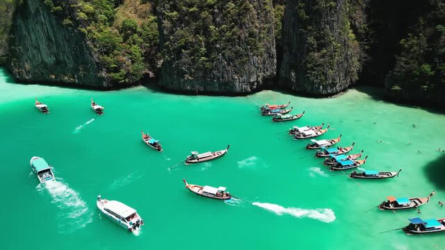 Aerial Pan Reveal Longtail Boats Pi Leh Bay Phi Phi Islands