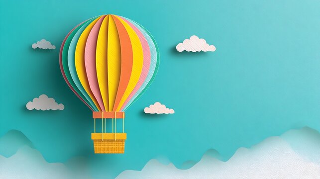 Hot air balloon with rainbow stripes floating in light blue sky with clouds