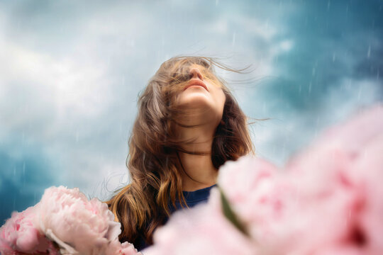 Woman looking Up in Rain with pink Flowers