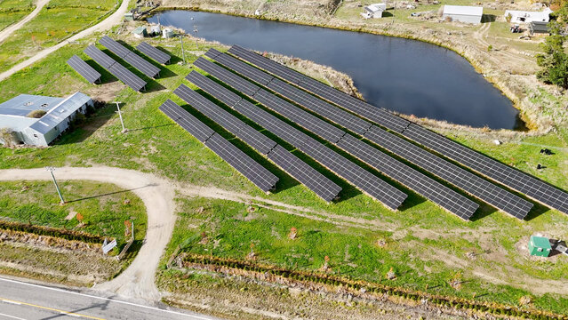 Aerial View of Solar Panel Array Near Pond in Cromwell New Zealand