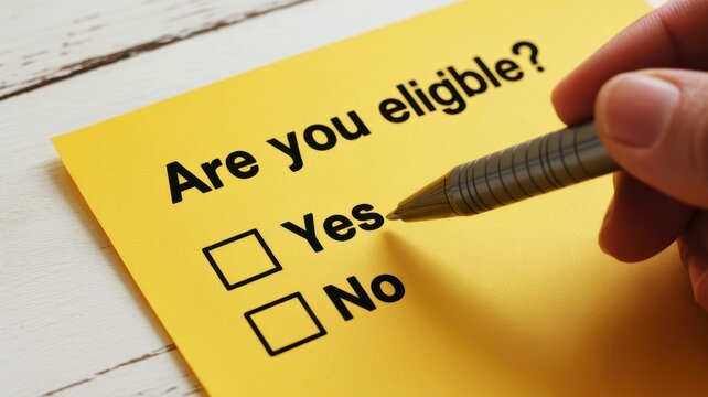 Person filling out eligibility form checking yes box