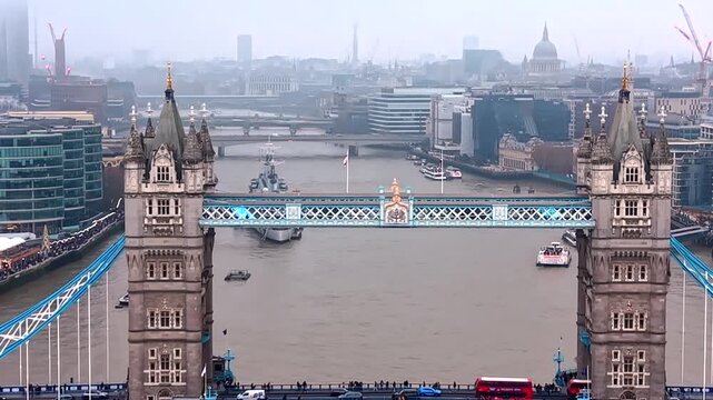 Tourists Visiting Tower Bridge With City Skyline In The Background In London, United Kingdom. Aerial Shot.