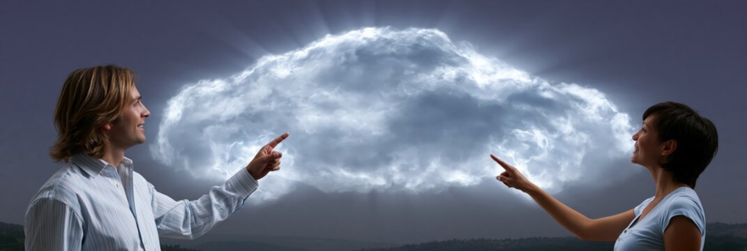 Business team pointing at glowing cloud formation representing cloud computing for technology banner and teamwork background