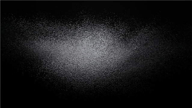 Abstract grainy textured background with subtle light burst effect on dark backdrop.