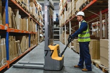 Fototapeta premium Storehouse manager supervising the lift truck operator