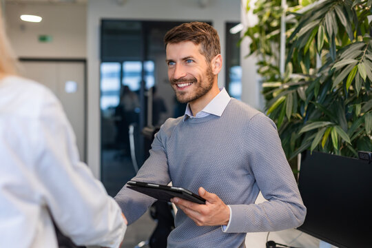 Businessmen shaking hands during a meeting.