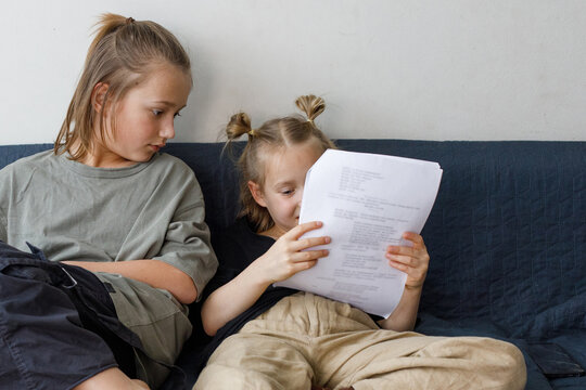 Little sibling learning a role for the school drama club at home
