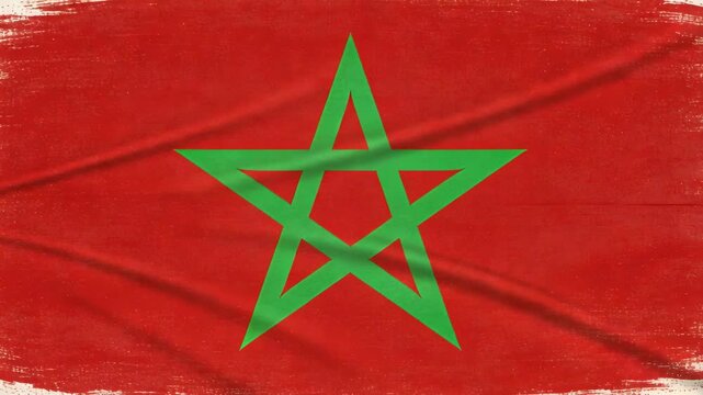 Showing centered Moroccan star flag developing fabric creases from frame four, revealing texture