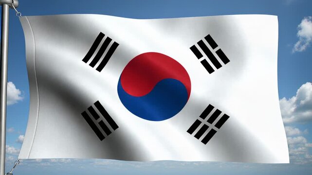 Waving South Korean flag rippling on pole outdoors as breeze blowing, showing grommet and clouds