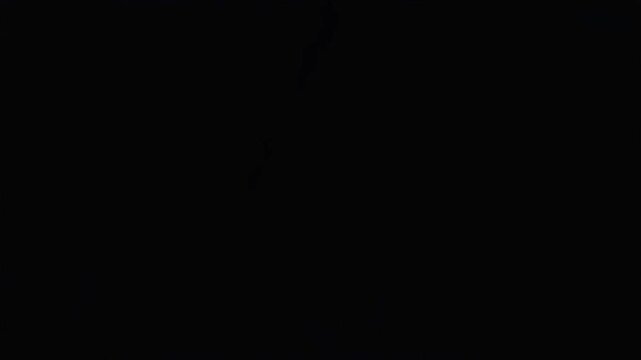 Lightning bolt strike with intense electrical discharge glowing against a dark night sky for dramatic cinematic motion effects