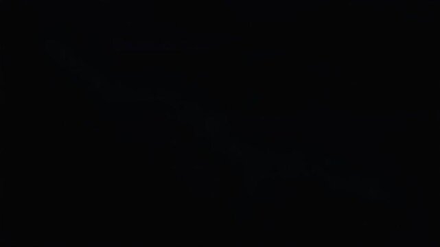 Lightning strike flashing through dark sky with intense electrical plasma surge creating a dynamic glowing blue cinematic visual effect