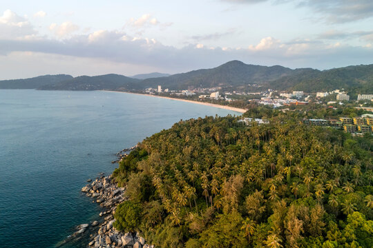 An expansive aerial vista captures Karon Beach and its town in Phuket, Thailand