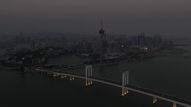 Aerial view of macau tower and sai van bridge at dusk