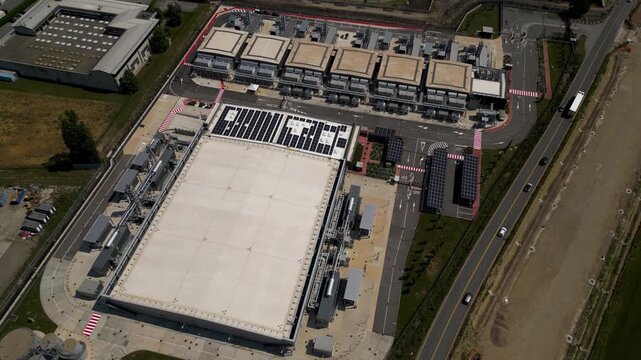 Hyperscale data center campus near Milan, Italy. Modern cloud computing infrastructure with industrial server facilities and technology buildings.
