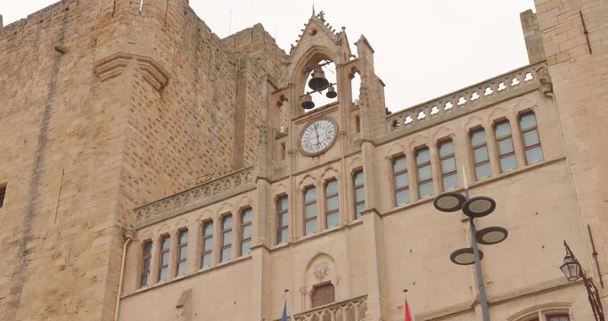 Historic Palace of the Archbishops in Narbonne France captured in bright sunshine with classic medieval architecture.