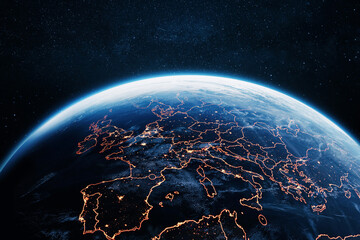 Obraz premium stunning satellite view of Europe at night from space, showing glowing city lights and golden country borders against the dark blue planet Earth, with a starry cosmos backdrop