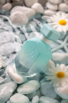 Aromatic blue perfume as symbol of sea breeze and freshness.