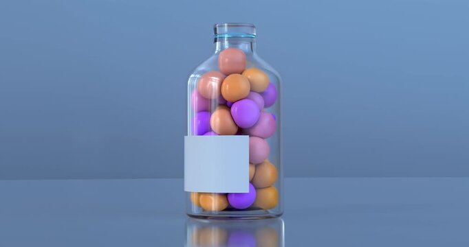 A transparent glass bottle with a blank white label is filled with colorful pastel pink, orange, and purple spheres against a soft blue background.
