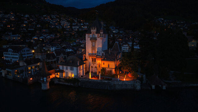 Aerial Night View of Oberhofen Castle on Lake Thun, Bern, Switzerland