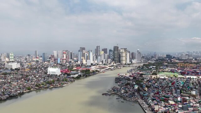 Aerial view showing contrast between slums and modern manila skyline