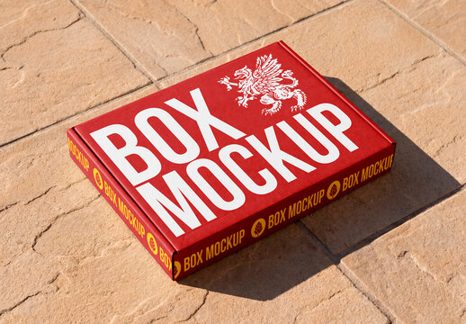 Minimal cardboard shipping box mockup on stone surface