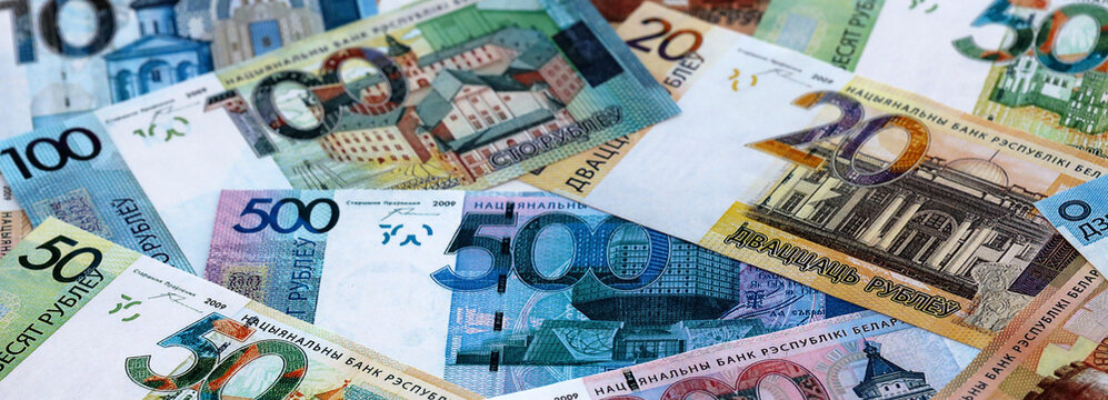 Belarusian ruble money banknotes pile on table. Belarus bills of BYN currency close up